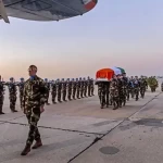 Troops render Honours for Pte Rooney at Beirut Airport