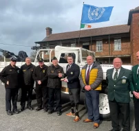 Bryan Philips receiving a presentation from Kieran Flynn IMVG