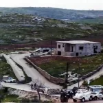 The DFF half track is to the left of the building. C Coy personnel at the check point UNIFIL
