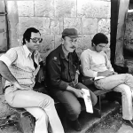 This photo was taken some time before 18 Apr 1980. It shows the Associated Press Bureau Chief in Beirut, Steve Hindy on the right, Haddad in the centre and a man in civilian dress. Mr Hindy describes this man as Haddad’s Israeli minder in an article written by him and titled “Between Beirut and a Hard Place. There is a strong resemblance between the minder and the man on the left in the previous photo Hindy