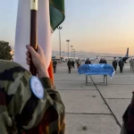 Pte Rooneys coffin draped in the UN flag prior to repatriation to Ireland