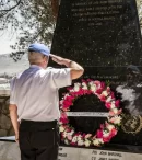 Denis Barry saluting at the Irish Memorial Tibnin UNIFIL